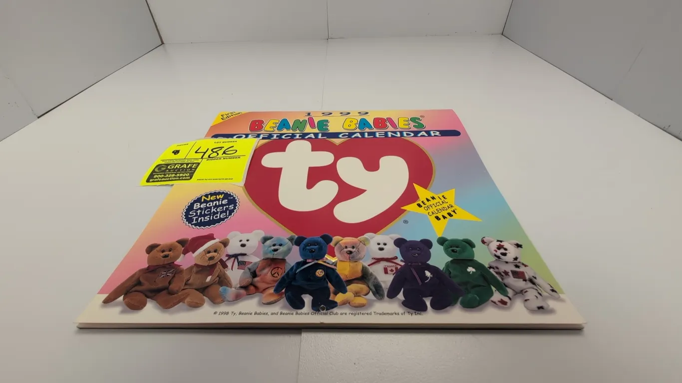 A 1999 Ty Beanie Babies Official Calendar. (Ty, 1999) An official first edition wall calendar featuring full-color photography of Beanie Babies plush