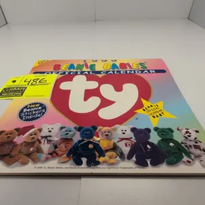 A 1999 Ty Beanie Babies Official Calendar. (Ty, 1999) An official first edition wall calendar featuring full-color photography of Beanie Babies plush 