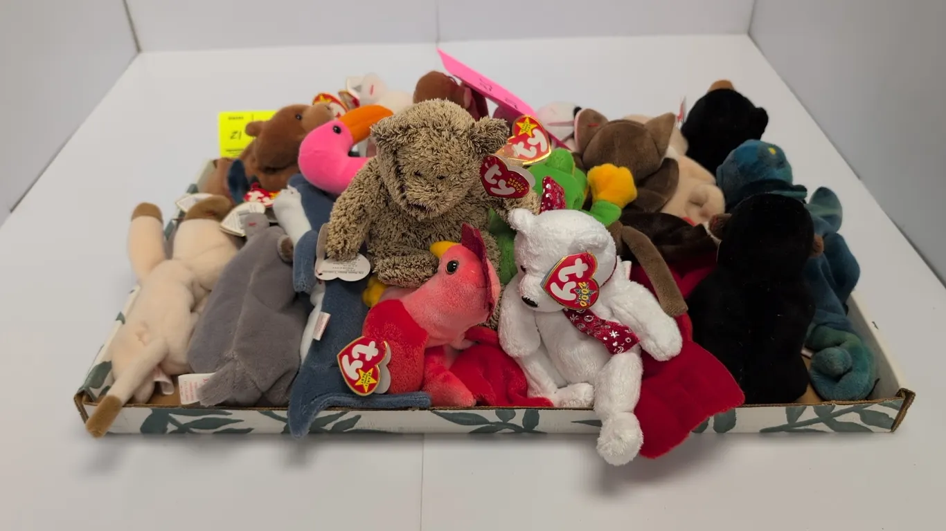 A Collection of Ty Original Beanie Babies. (Ty, 1990s-2000s) An assortment of plush animal figures including Claude the Crab, 2000 Holiday Bear, Bongo