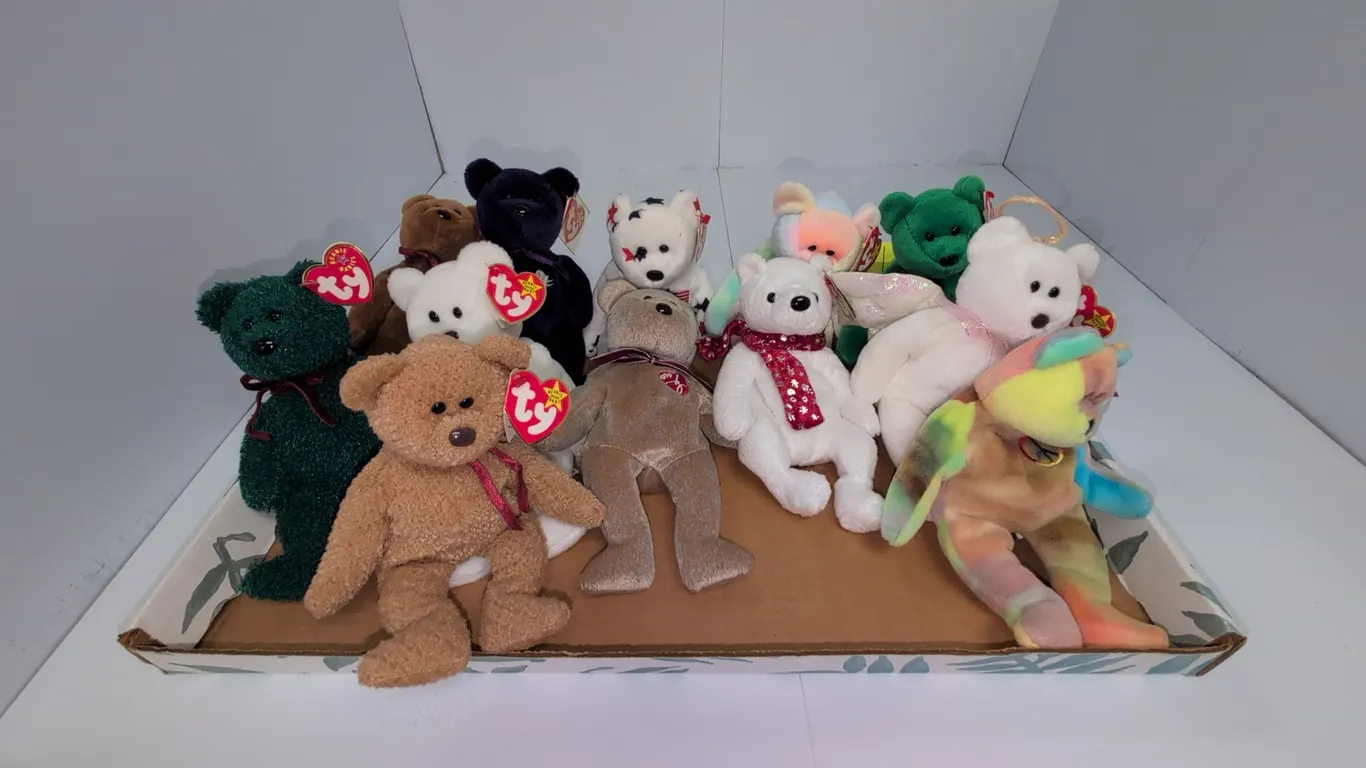 A Collection of Ty Original Beanie Babies Bear Plush Toys. (Ty, 1990s-2000s) An assortment of twelve bear plush figures including Peace, Halo, and Hol