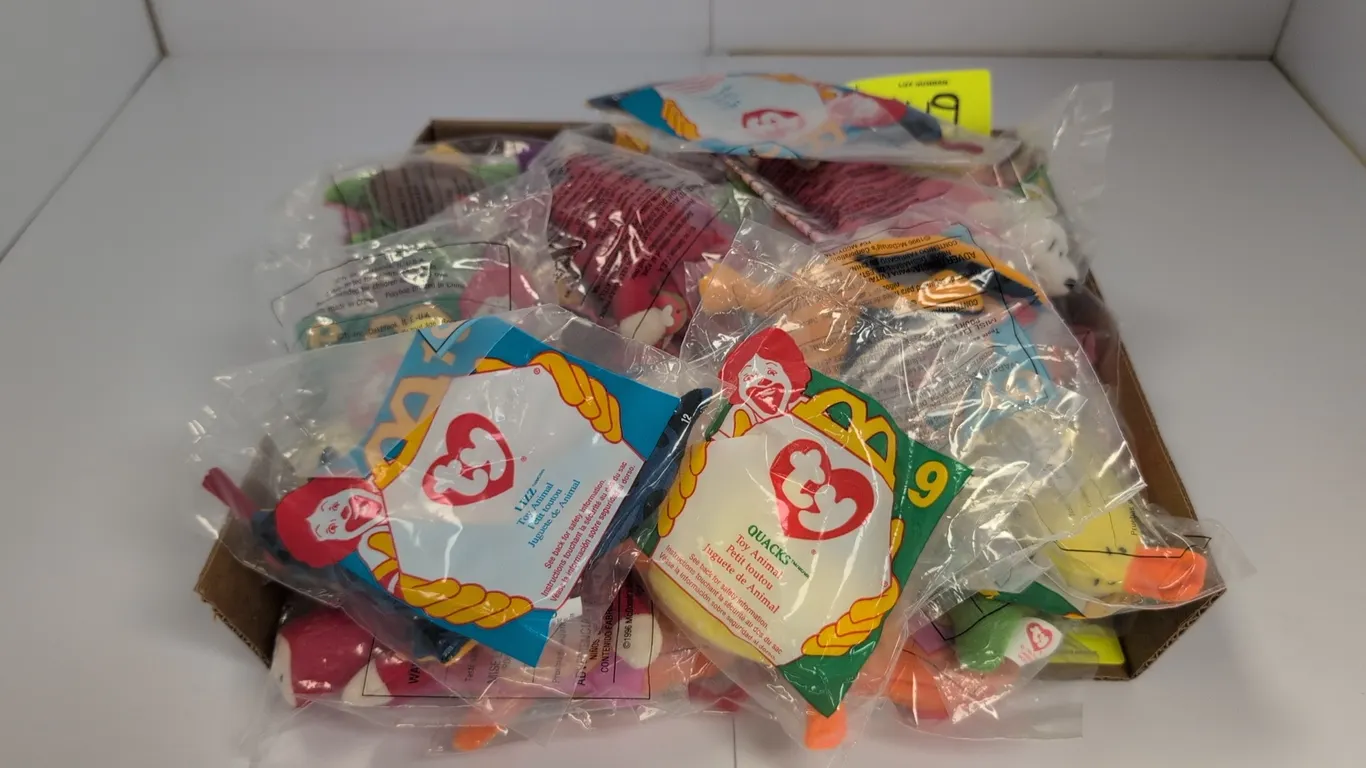 A Collection of Ty Teenie Beanie Babies. (Ty / McDonald's, 1996) A collection of plush Happy Meal toy animals, including Quacks the Duck, Lizz the Liz