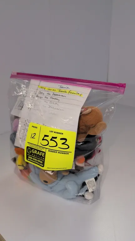 A Collection of Ty Teenie Beanie Babies. (Ty, 1998) A 12-piece collection of 1998 McDonald's promotion plush animals, including Doby, Bongo, Twigs, In