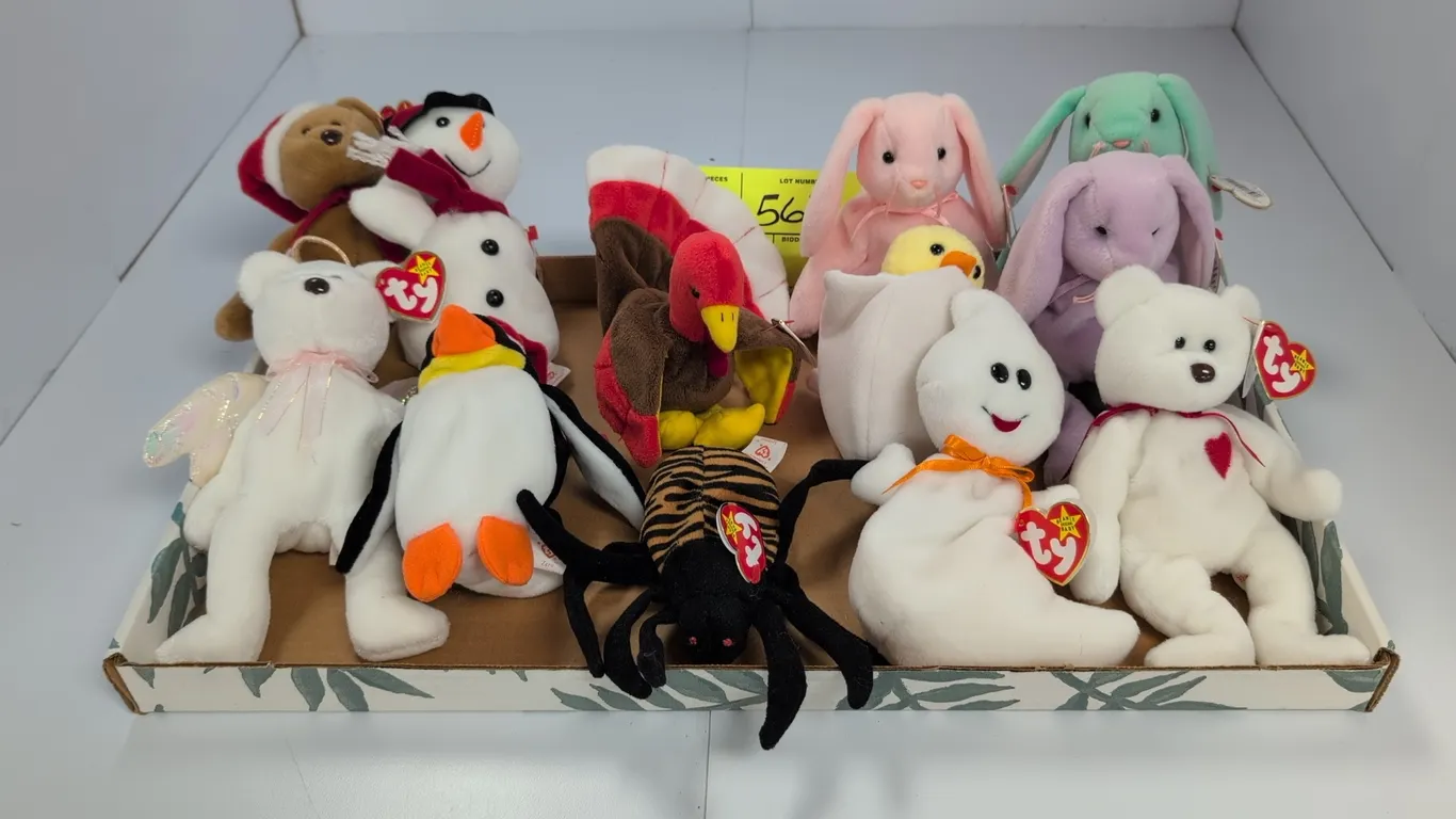 A Collection of Holiday Ty Beanie Babies. (Ty, 1990s) A set of 12 holiday-themed plush Beanie Babies including Spooky the ghost, Spinner the spider, G