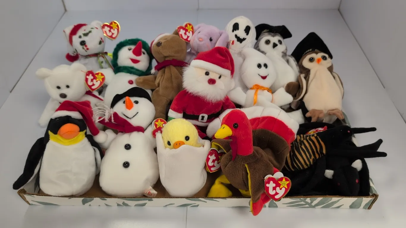 A Collection of Holiday Ty Beanie Babies. (Ty, 1990s-2000s) An assortment of holiday and seasonal plush figures, including Gobbles the Turkey, Santa C