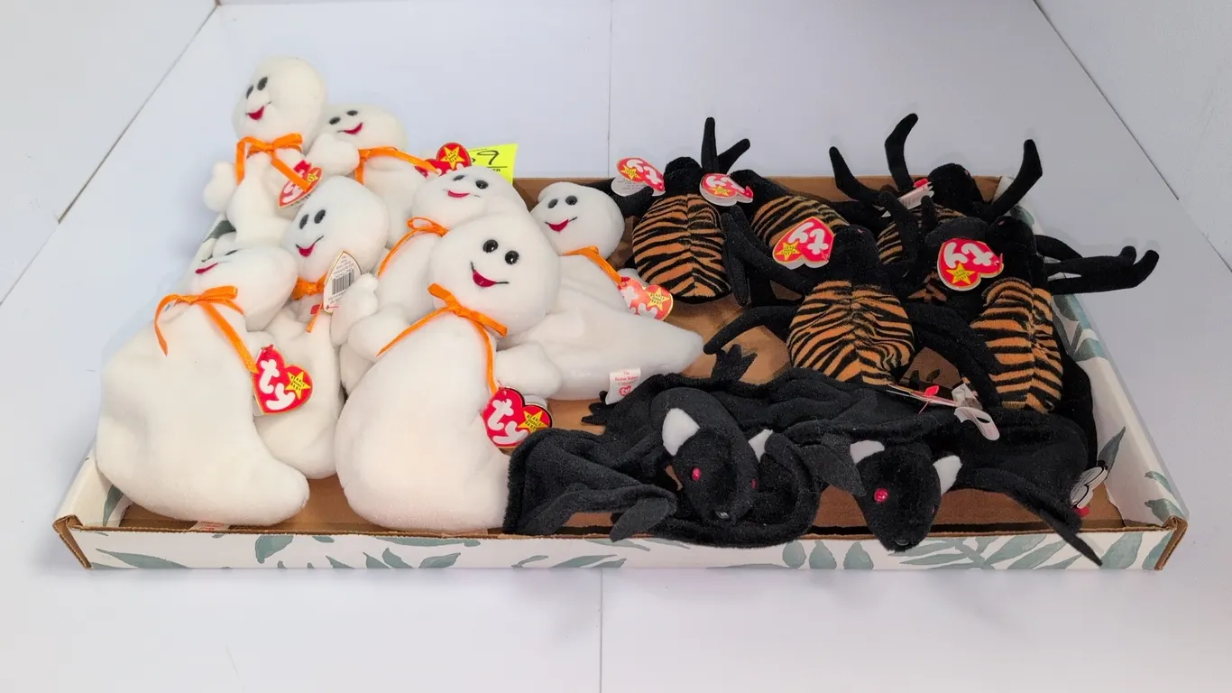 A Collection of Halloween Ty Beanie Babies. (Ty, 1990s) A collection of Halloween-themed plush toys featuring Spooky the ghost, Radar the bat, and Spi