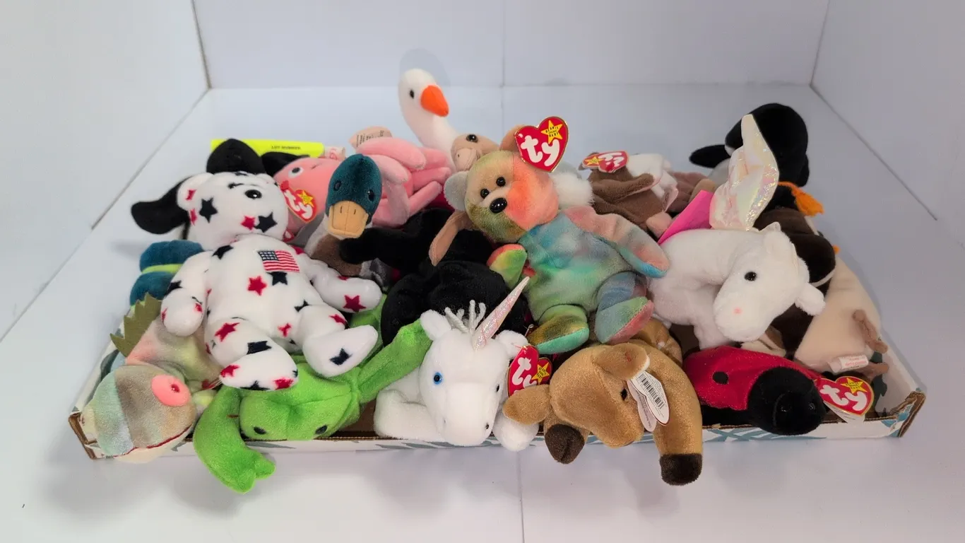 A Collection of Ty Beanie Babies. (Ty, 1990s) A collection of Ty Beanie Babies plush toys featuring various animal characters including Goochy the jel