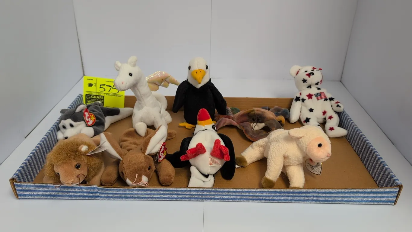 A Collection of Ty Beanie Babies. (Ty, 1990s) A set of 9 assorted plush Beanie Babies including Roary the lion, Nanook the husky, Baldy the eagle, Spa