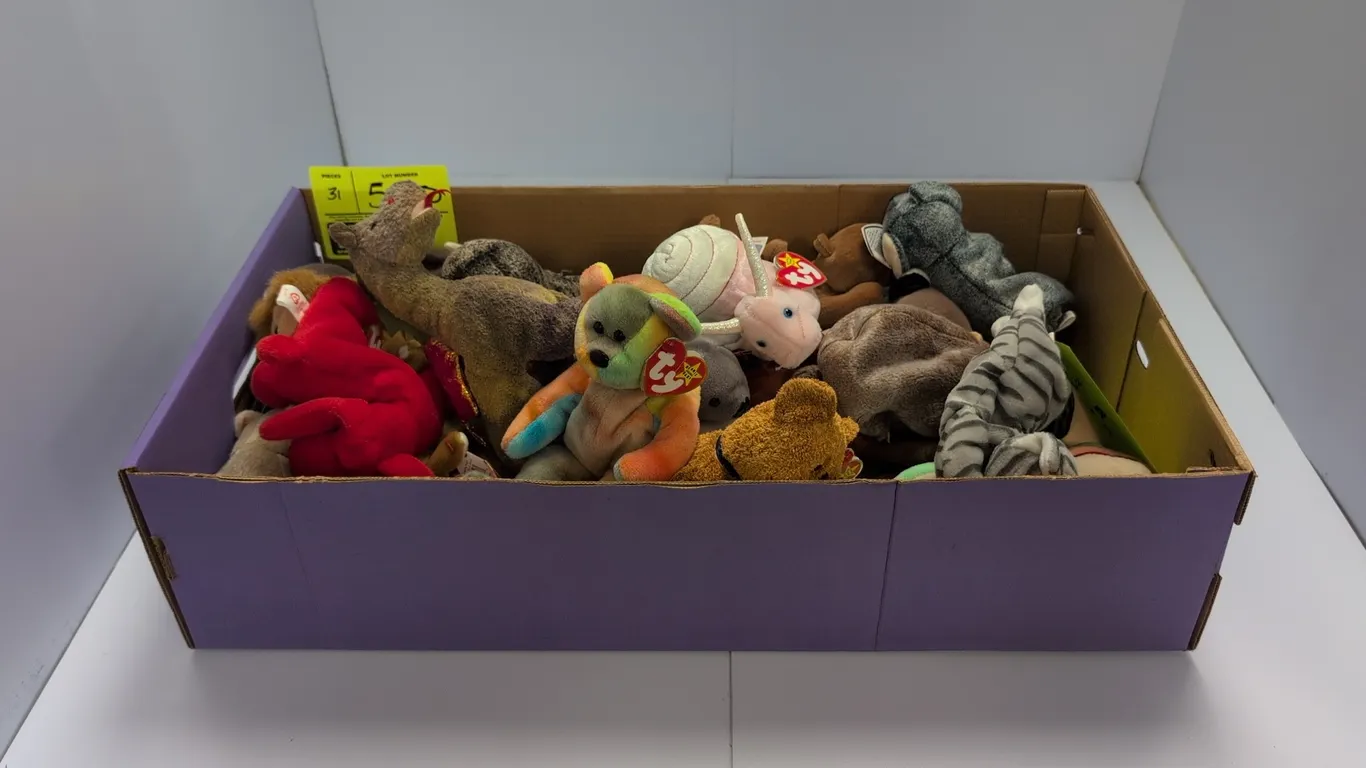 A Collection of Ty Beanie Babies Plush Toys. (Ty, 1990s) An assortment of Ty Beanie Babies plush animal figures, including Seaweed the otter, Batty th