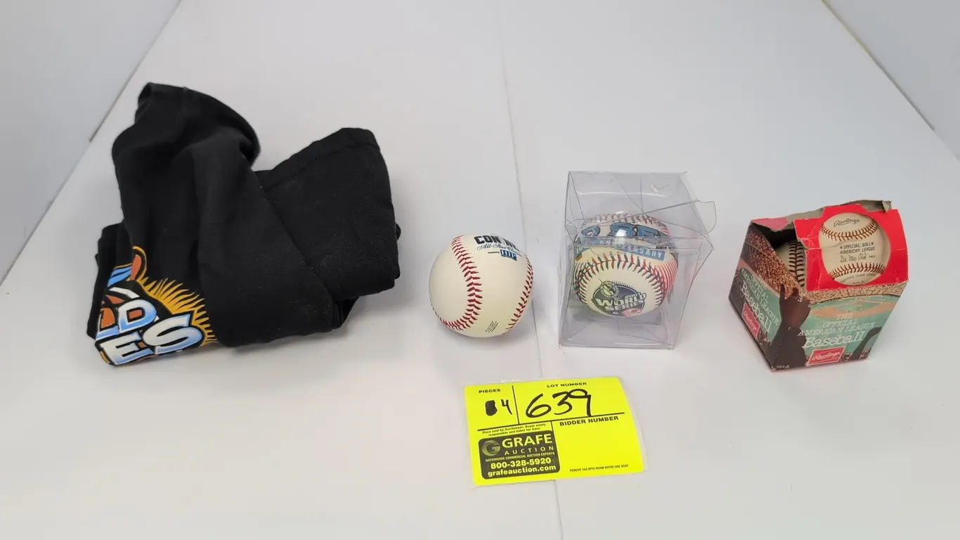 A Collection of Baseball Memorabilia. (MLB, 1974-2003) Includes a 2003 Florida Marlins World Series adult XL t-shirt, a 2003 World Series baseball in