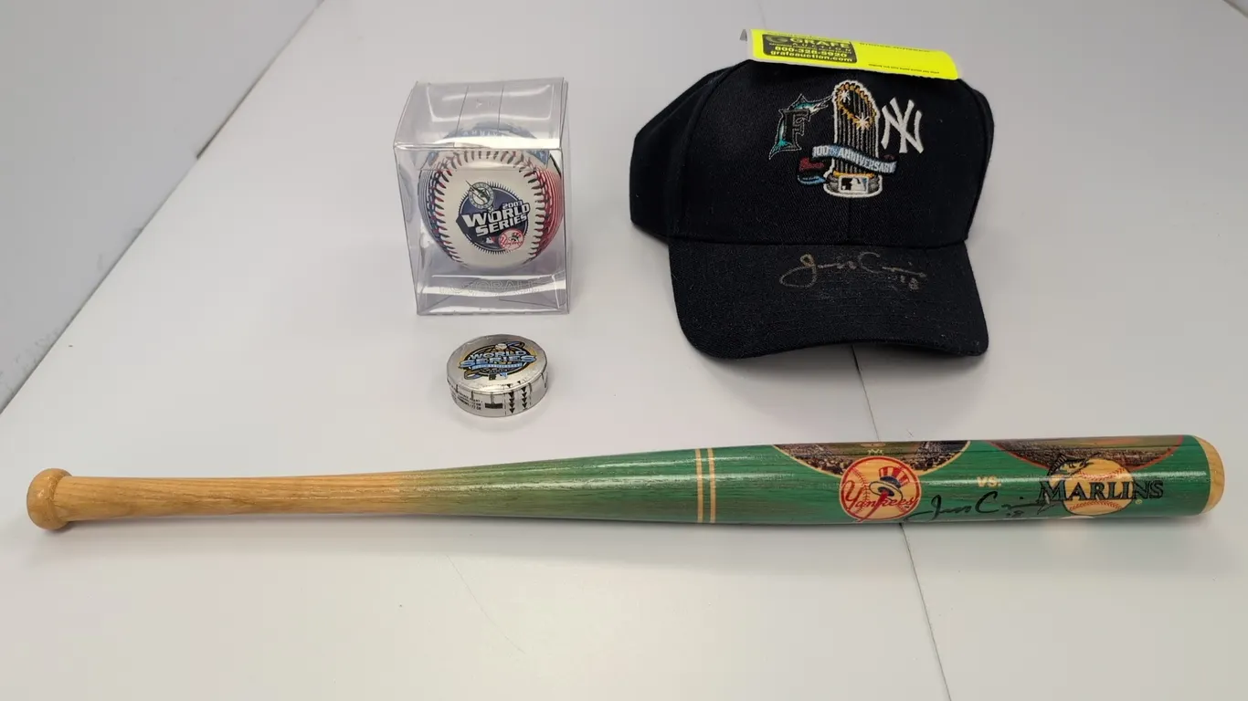 A Collection of 2003 World Series Memorabilia. (MLB, 2003) A 4-piece collection of Florida Marlins 2003 World Series memorabilia, including a Coopersb
