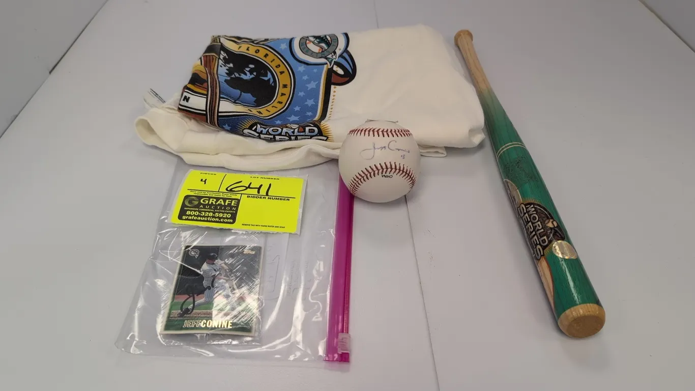 A Collection of 2003 World Series Florida Marlins Memorabilia. (MLB, 2003) A 4-piece collection including a Delta Pro Weight adult XL T-shirt, a Coope