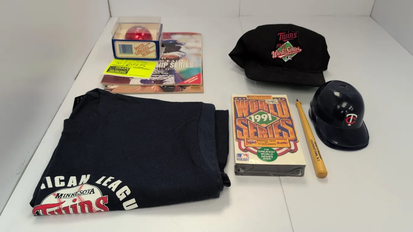 A Collection of Minnesota Twins 1991 World Series Memorabilia. (MLB, 1991) A collection of championship items including a Screen Stars size XL T-shirt