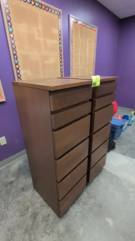Wood 6-drawer cabinets. Features a brown wood finish, six pull-out drawers with gray interior lining, and integrated drawer pulls. Dimensions: 16" x 1