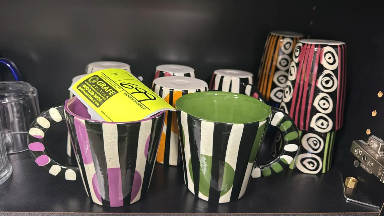 Decorative ceramic coffee cups. Features assorted hand-painted geometric, striped, and spotted designs with multicolor glaze finishes, colored interio