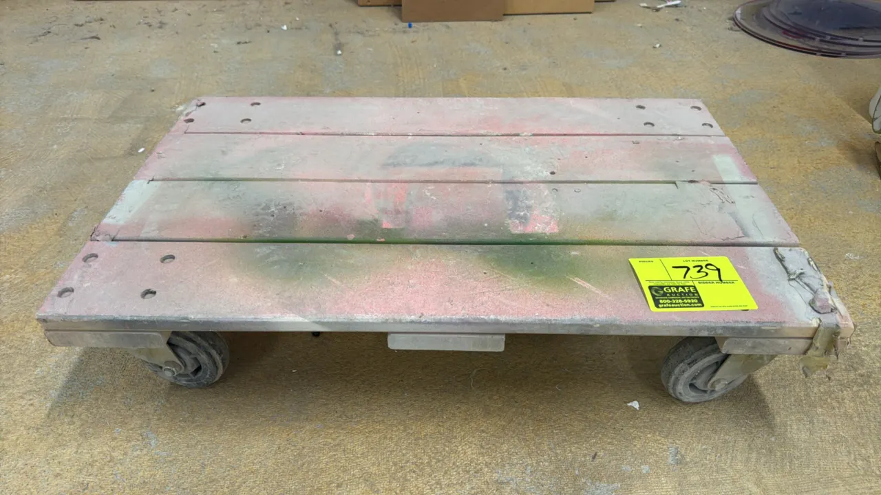 Wood 4-wheel platform dolly. Features slatted wood deck. 30"L x 18"W. Mounted on (4) casters.