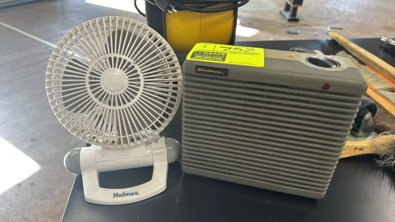 Windmere space heater and Holmes personal desk fan. Features an adjustable tilt fan head and rotary heat control dial with indicator lights on the hea