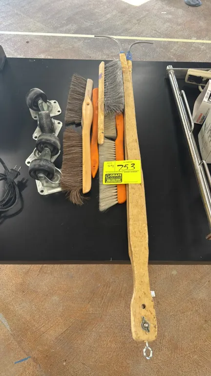 Package lot of workspace brushes, hooks, and casters. Includes (4) swivel plate casters, assorted counter and drafting brushes with wood and plastic h