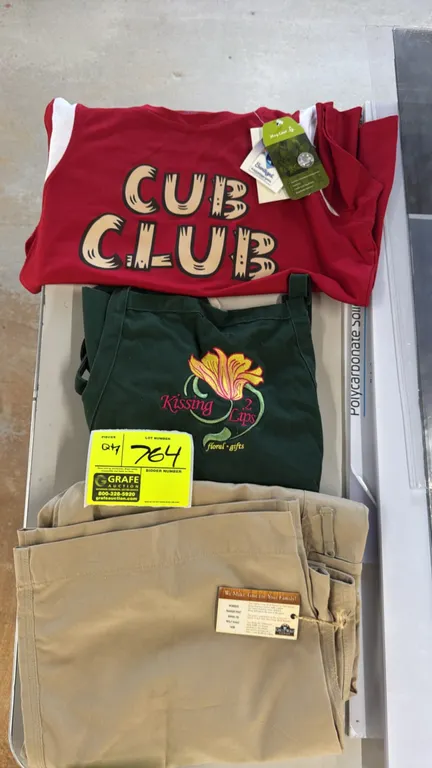 Apparel lot. Includes Great Wolf Lodge women's Ranger pant (size 14/29, model GW004-100, Wolf Khaki) with tags, red 'Cub Club' shirt (size Large) with