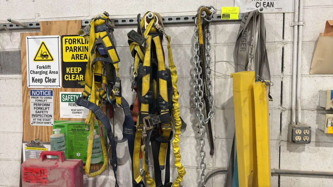 Package lot of safety and rigging equipment. Includes DBI-SALA fall protection harnesses with lanyards, heavy-duty link chain, crowbar, rigging straps