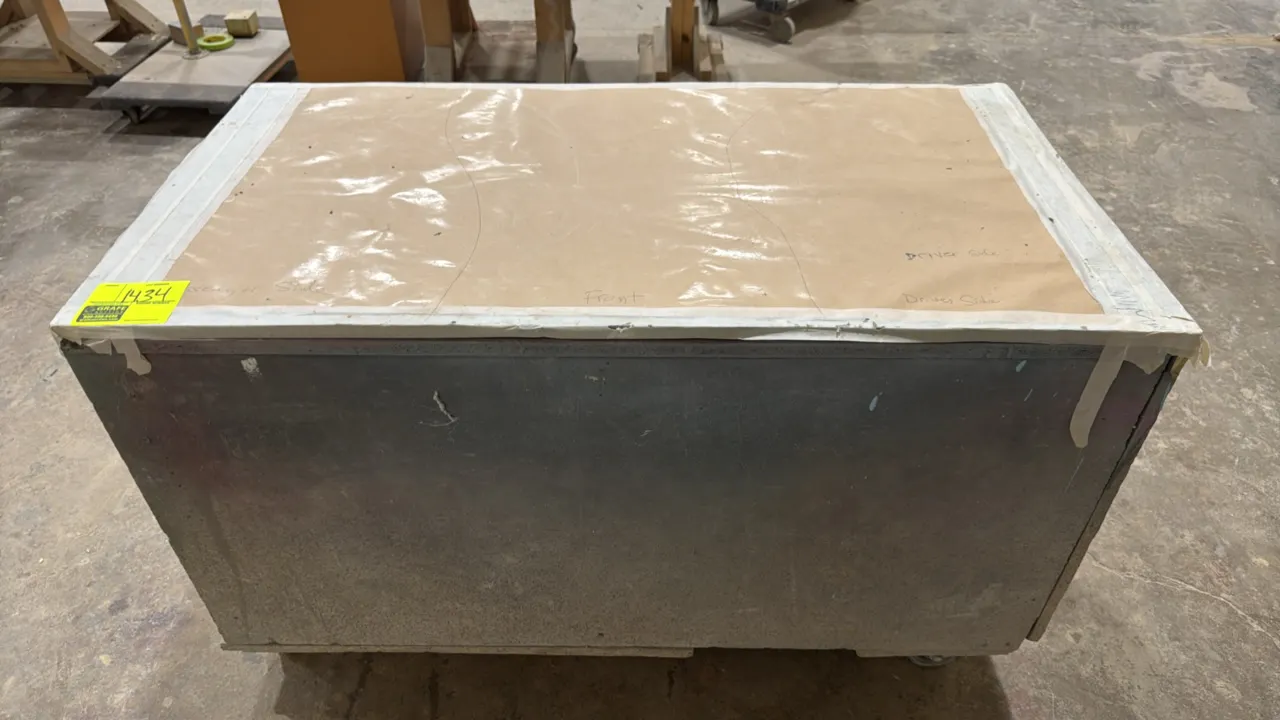 Wood portable workbench. Features enclosed wood construction with a paper-covered top surface. 48" x 25". Mounted on casters.