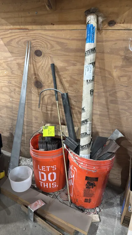Assorted welding rod and metal scrap lot. Includes (2) 5-gallon plastic buckets containing assorted welding electrodes (including 316L-16), scrap meta