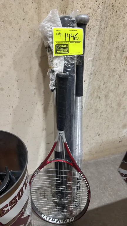 Assorted sporting equipment lot. Includes (1) Dunlop Comp 108 alloy tennis racket, (2) metal baseball bats, and (1) wood baseball bat.