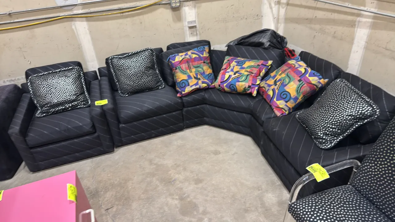 Designer Upholstery by Heirloom corner couch set. Includes 6' x 6' corner sectional couch, matching armchair, and assorted accent pillows. Features bl