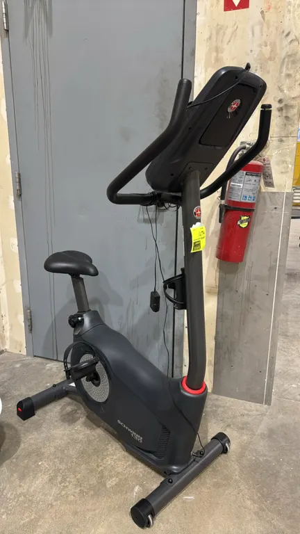 Schwinn 130 upright exercise bike. Features DualTrack LCD display console with workout fan, media rack, integrated handlebar pulse sensors, water bott