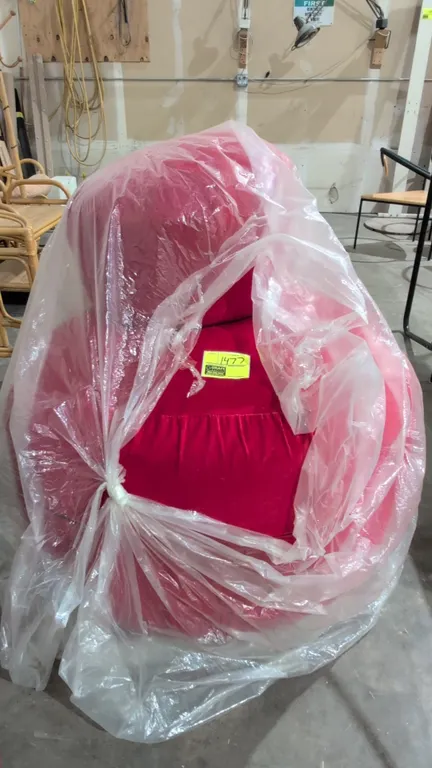 (1) 22" Beanbag chair and (1) 36" ottoman. Features red ribbed plush fabric upholstery.