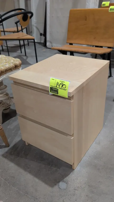 Wood 2-drawer filing cabinet. Features a light natural wood finish and two pull-out file drawers. 16" x 21"H.