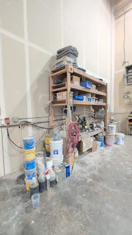Ashby Cross meter, mix, and dispense system. S/N: 8966. Features pneumatic dual-cylinder drive, dispense head, and Norgren air filtration regulator. P