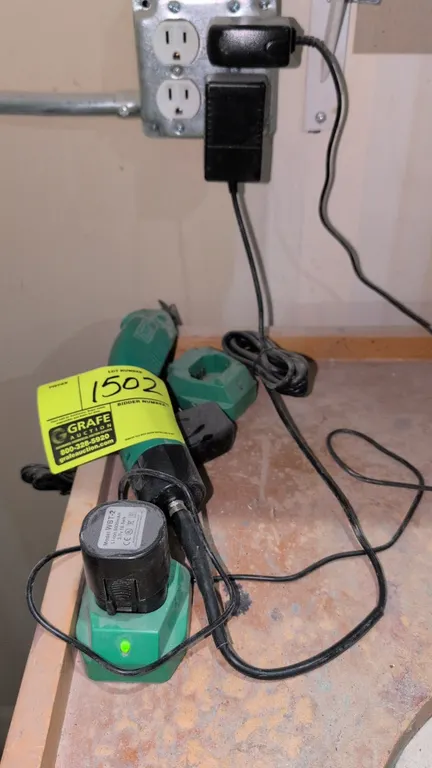 WBT WBT-2 electric scissors. Features ergonomic handheld design with trigger operation. Includes corded power adapter, (2) charging docks with AC powe