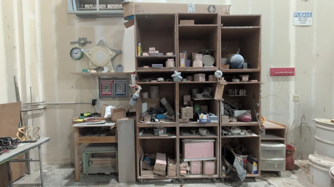 Shop storage and workstation lot. Includes (3) wood portable shelving cabinets, 39" desk, small side cabinet with drawers, tools, molds, and assorted