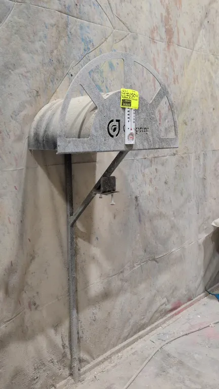 Assorted spray room furnishings and equipment. Includes wall-mounted hose racks, air and material hoses, (1) rolling task chair, (3) rolling shop stoo