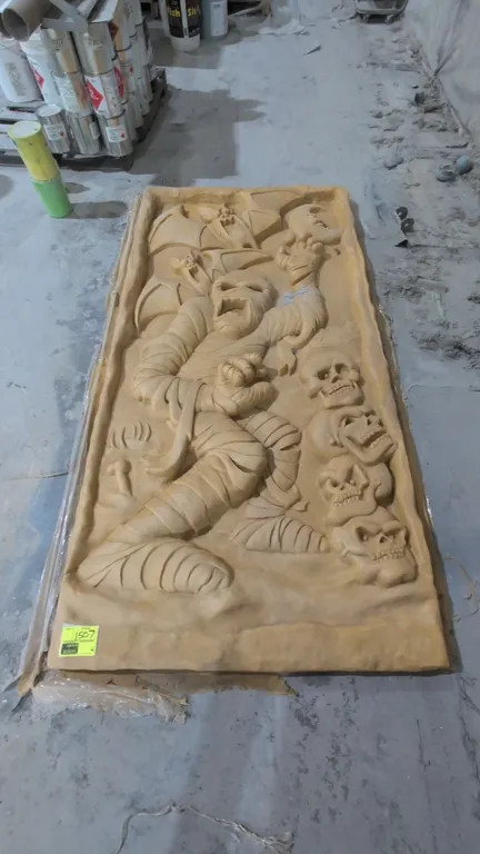 A Large Cast Resin Halloween Relief Art Panel. Features a high-relief molded scene depicting a stylized mummy, flying bats, a crescent moon, and a ver