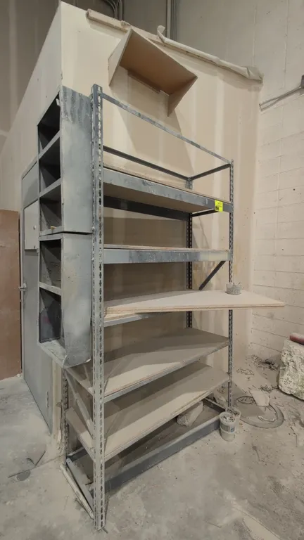 Metal shelving rack with side compartments. Features adjustable shelf levels with decking and side-mounted metal storage compartments. Dimensions: 4'