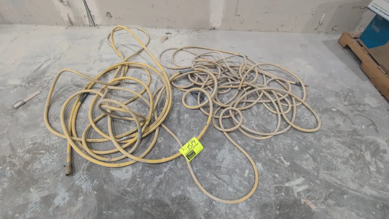 Husky air hoses. Includes (1) 1/4" ID hose and (1) 3/8" ID hose. Features yellow hybrid construction, quick-connect fittings, and bend restrictors.