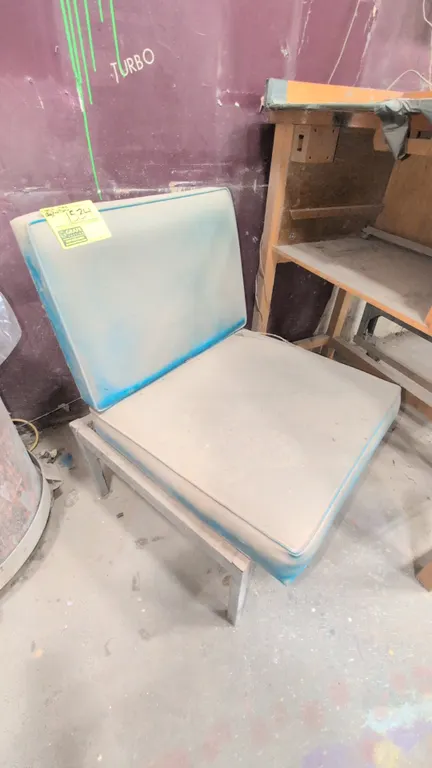 Furniture lot. Includes cushioned chair with metal base, 41" wood table with drawer, 80" portable table on casters, 83" workbench table with lower she
