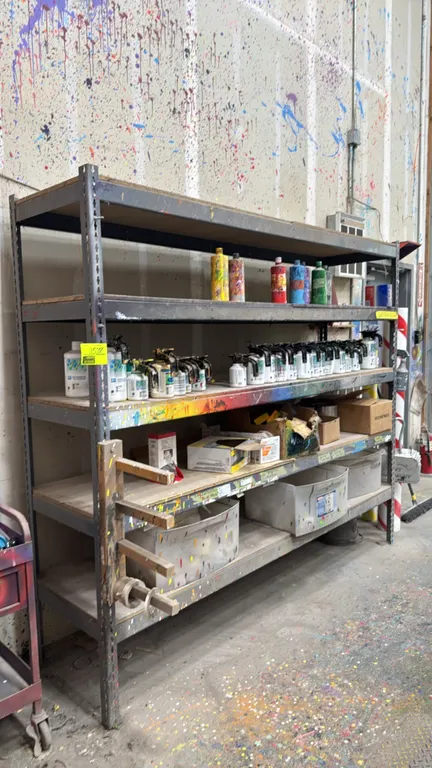 8'L metal 5-tier storage rack. Features wood decking and an attached side dispenser bracket. Dimensions: 8'L x 2'W x 7'H. Contents not included.