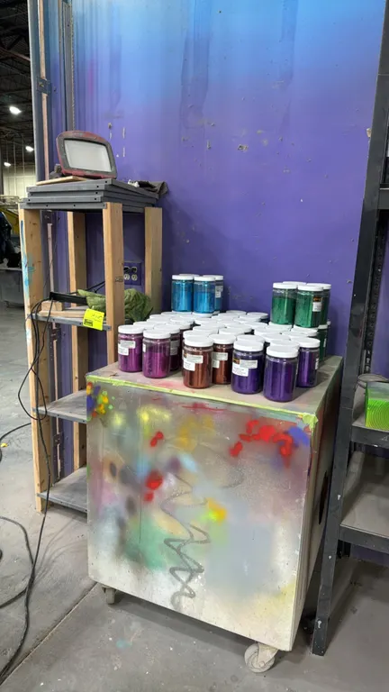 Wood storage cabinets. Includes a tall 4-tier wood-frame shelving unit with metal shelves and a mobile wood cabinet on casters. Features multicolored