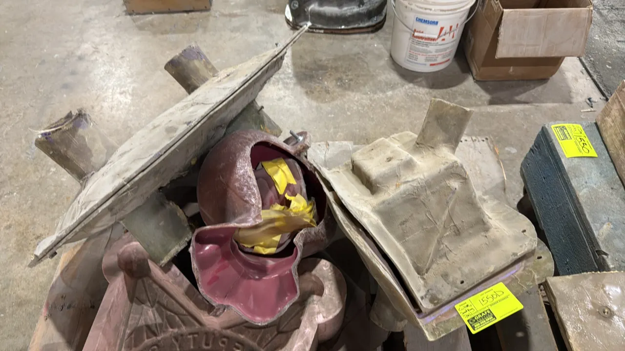 Assorted fiberglass casting molds. Includes cube and sandbag mold sections. Features composite fiberglass construction with integrated pour spouts and