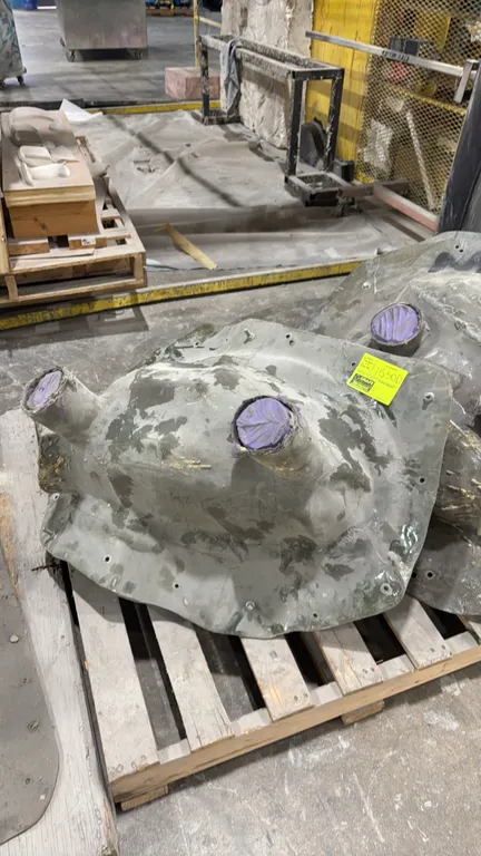 32" Raccoon on Book casting mold. Features a fiberglass outer support jacket with bolted flanges and a flexible inner casting liner. 32".