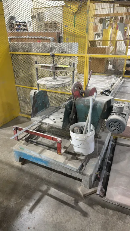 Miller paint mixer. Features adjustable hand-crank screw clamp for 5-gallon pails and electric motor drive. S/N: 5M5990978. Electrical: 115V, 10.9A. M