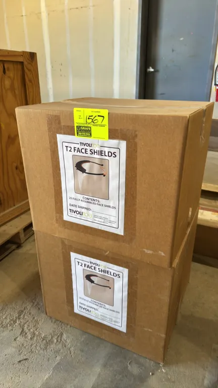 TivoliToo T2 fully-assembled face shields. Features clear poly visors with headbands. Marked as 25 fully-assembled shields per box.