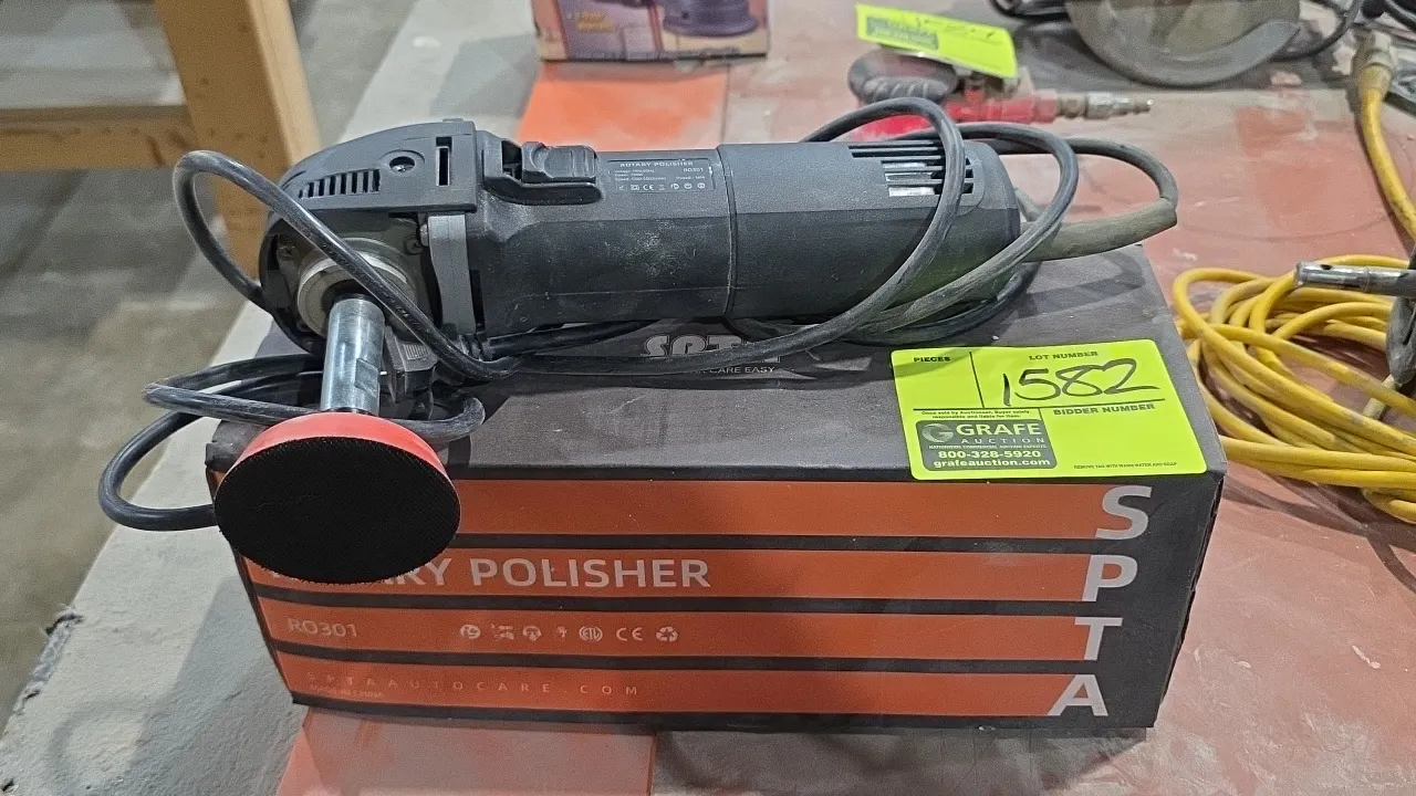SPTA RO301 corded rotary polisher. Features shaft extension, hook-and-loop backing pad, and original box. Technical specs: 1,000-5,000 RPM, M14 thread
