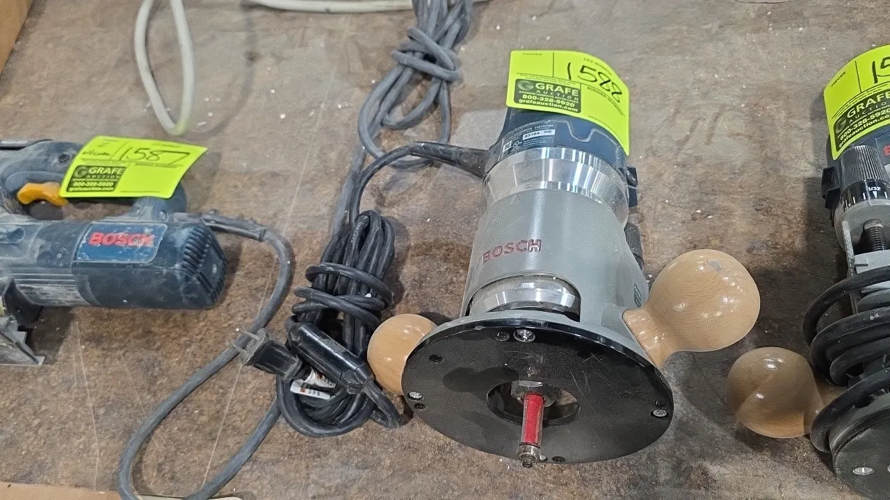 Bosch 1617EVS corded router. Features a fixed base with dual wooden handles, variable speed control (8,000-25,000 RPM), and an installed router bit. E