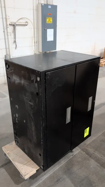 HON 2-door metal filing cabinet. Features double hinged doors with recessed vertical pull handles and a black finish. Dimensions: 36" x 28". Dolly not