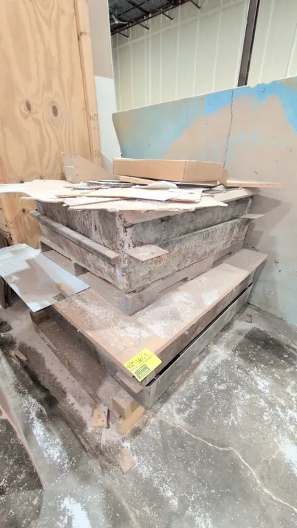 Assorted steel concrete base forms. Features fabricated heavy-gauge steel construction with side mounting tabs and tapered designs. Palletized for tra