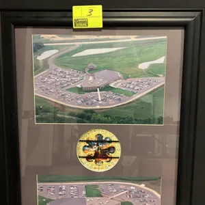 Framed Autumn Ridge Church aerial photograph display. Features two aerial views of the church facility and grounds flanking a central circular depicti