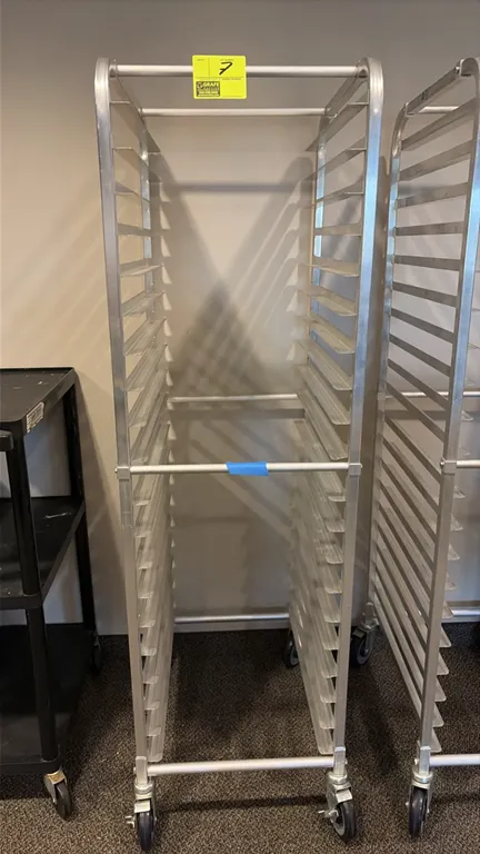 Aluminum front-load pan rack. Features 20-tier angle runners for sheet pans. Mounted on swivel casters.
